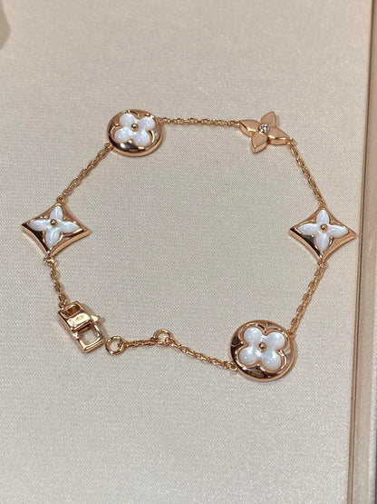 [Angela Jewellery]Armband mit Stern- und Sonnenmotiv, 5 Perlmutt-Rotgold
