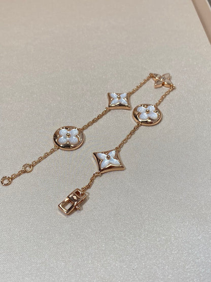 [Angela Jewellery]Armband mit Stern- und Sonnenmotiv, 5 Perlmutt-Rotgold