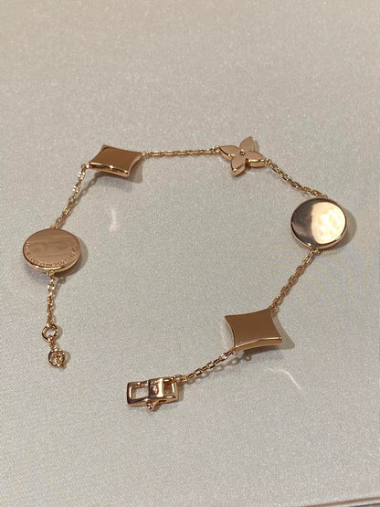 [Angela Jewellery]Armband mit Stern- und Sonnenmotiv, 5 Perlmutt-Rotgold