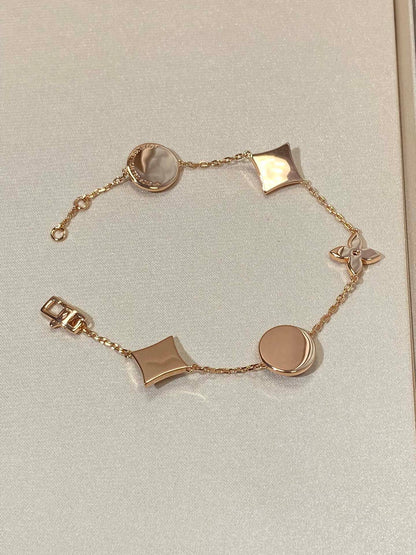 [Angela Jewellery]Armband mit Stern- und Sonnenmotiv, 5 Perlmutt-Rotgold