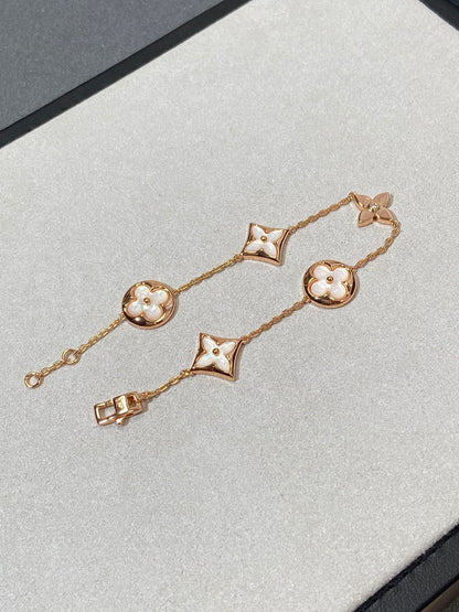 [Angela Jewellery]Armband mit Stern- und Sonnenmotiv, 5 Perlmutt-Rotgold