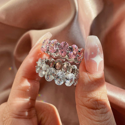 Angela Jewelry]Zierlicher, länglicher Tennisring im Kissenschliff